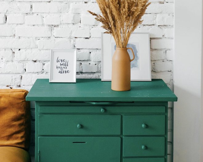 green drawer in front of white wall